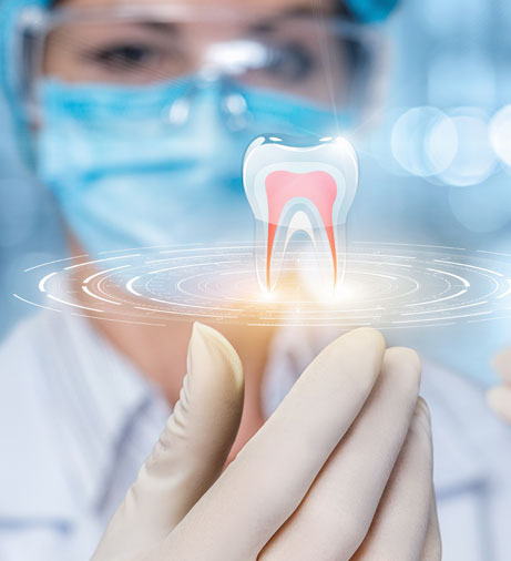 Dentist in surgical mask holding holographic tooth model in sterile clinical environment.