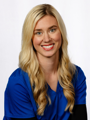 Professional headshot of a blonde woman in blue top smiling at Fremont Dental Group