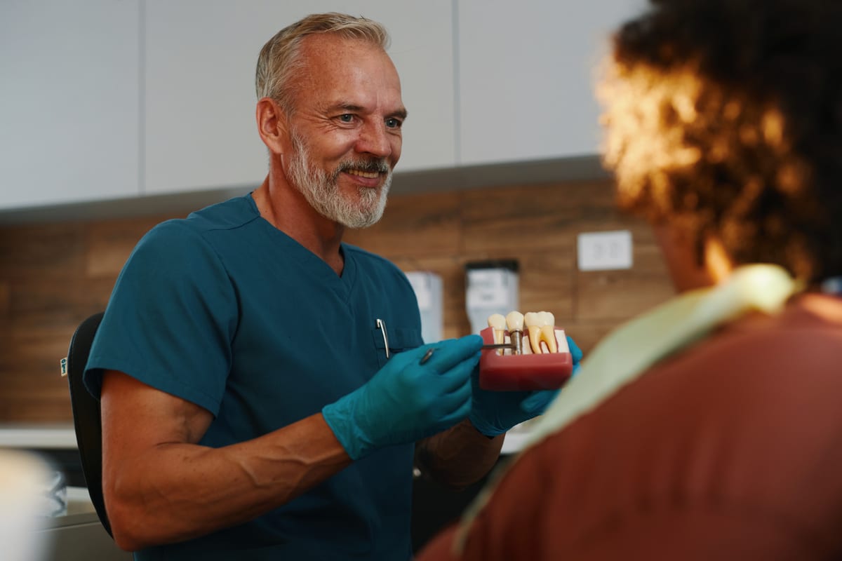Featured image for “Dental Implants vs Dentures: Which Option Actually Fits Your Life”